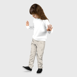 Брюки с принтом Бежевый для ребенка, вид на модели спереди №2. Цвет основы: черный