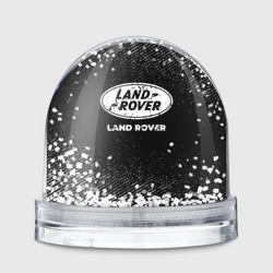 Игрушка Снежный шар Land Rover с потертостями на темном фоне