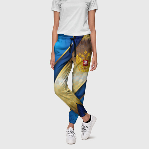Женские брюки 3D с принтом Золотой герб России на синем объемном фоне, фото на моделе #1