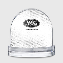 Игрушка Снежный шар Land Rover с потертостями на светлом фоне