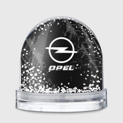 Игрушка Снежный шар Opel Speed на темном фоне со следами шин