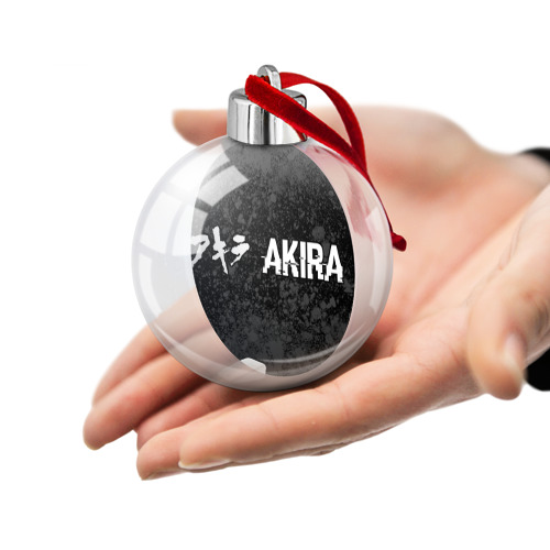 Ёлочный шар Akira glitch на темном фоне: надпись и символ - фото 2