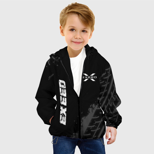 Детская куртка 3D с принтом Exeed speed на темном фоне со следами шин: надпись, символ, фото на моделе #1