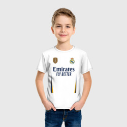 Футболка с принтом Винисиус Жуниор ФК Реал Мадрид форма 23-24 домашняя для ребенка, вид на модели спереди №2. Цвет основы: белый