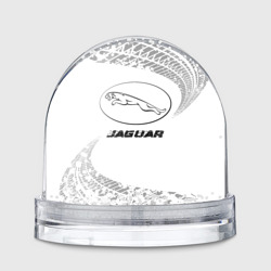 Игрушка Снежный шар Jaguar speed на светлом фоне со следами шин