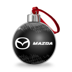 Ёлочный шар Mazda speed на темном фоне со следами шин по-горизонтали