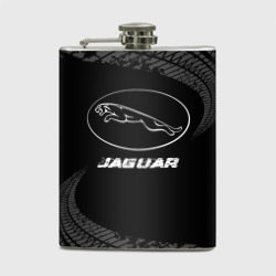 Фляга Jaguar speed на темном фоне со следами шин