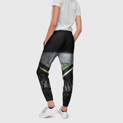 Брюки с принтом Black  green abstract nvidia style для женщины, вид на модели сзади №2. Цвет основы: черный