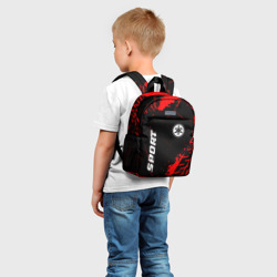 Рюкзак с принтом Yamaha red sport tires для ребенка, вид на модели спереди №2. Цвет основы: белый