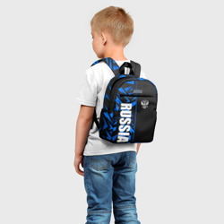 Рюкзак с принтом Россия - синяя абстракция для ребенка, вид на модели спереди №2. Цвет основы: белый